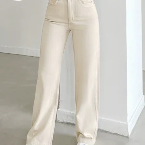 Women's autumn jeans, made of cotton denim, in a beige apricot color, straight-leg, slim fit, high-waisted, elastic waistband